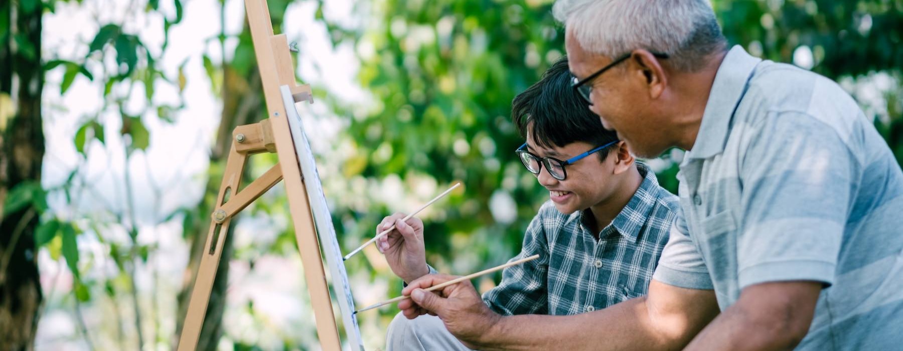 a father and son painting