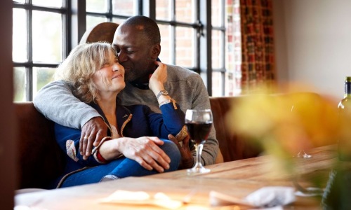 a couple sitting in a restaurant