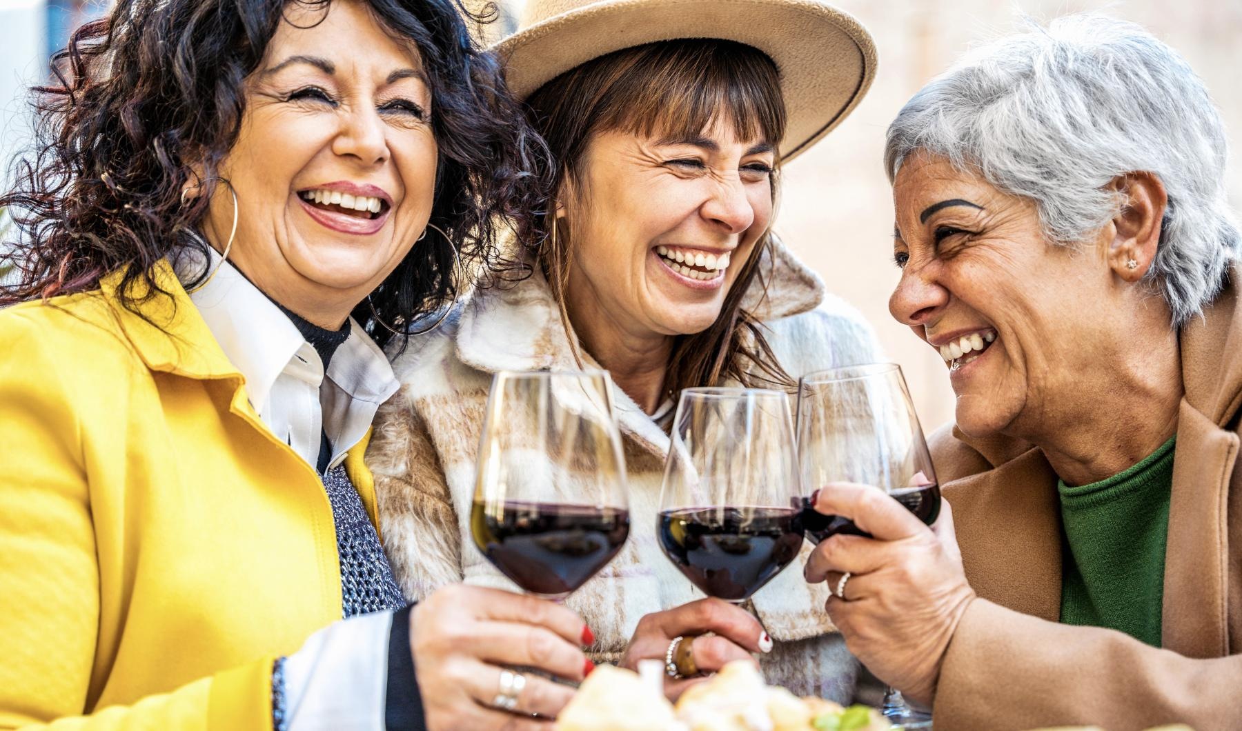 a few women enjoying a glass of wine